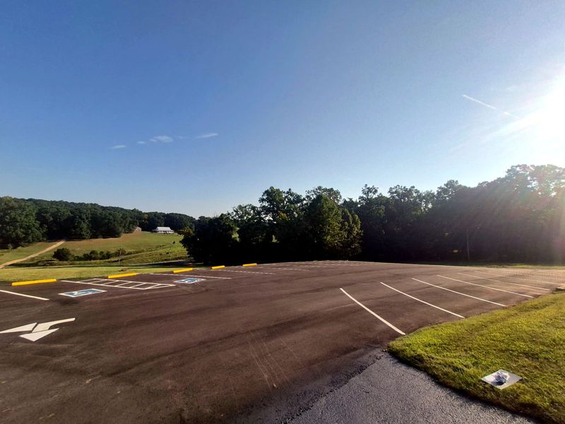 Wide view of a sealcoated and striped commercial parking lot