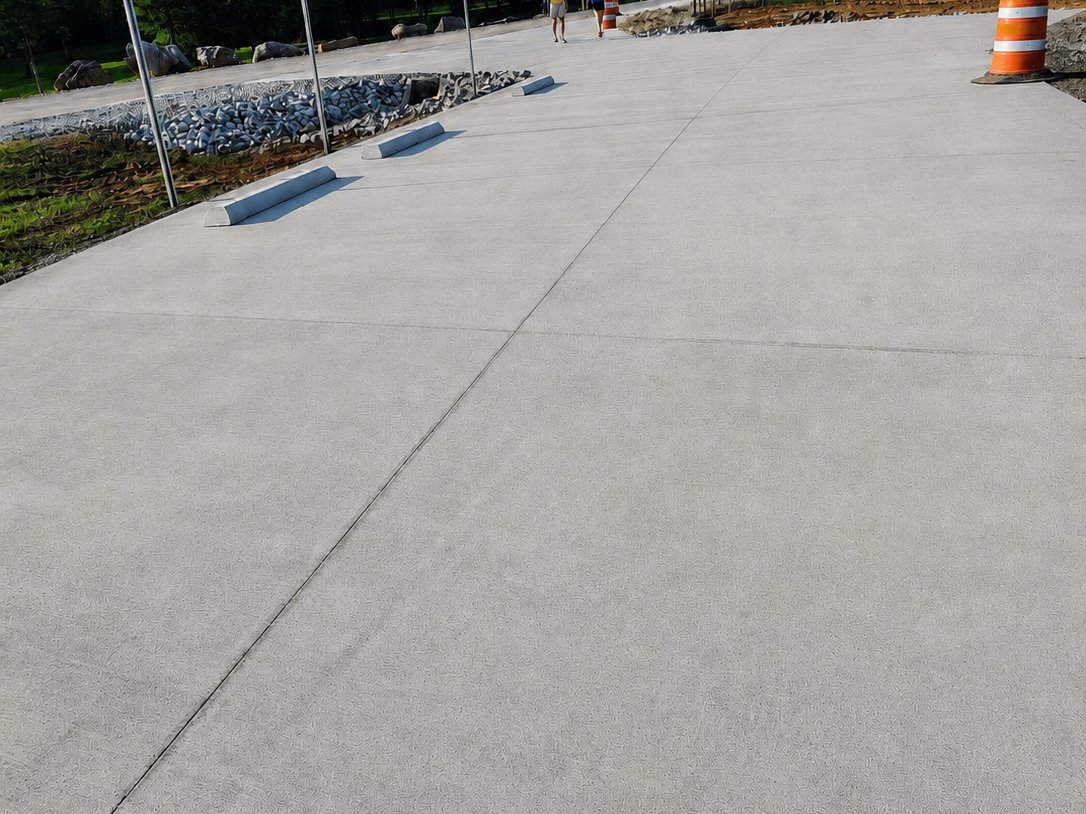 New concrete parking lot after ADA striping with handicap symbols