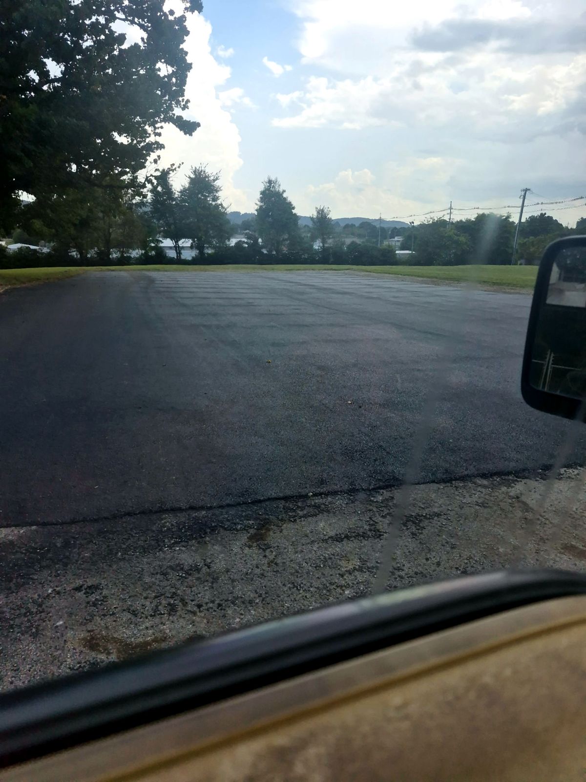 Asphalt parking lot before sealcoating in Sweetwater, Tennessee